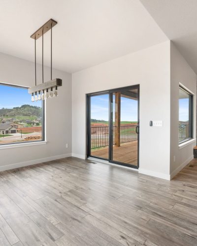 Living room with wood flooring in Spec House built by Black Hills Homes.